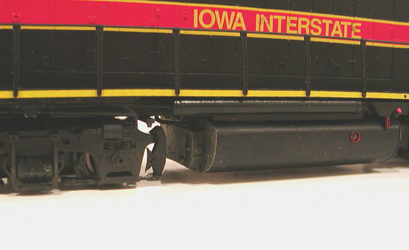 Fuel tank and trucks.  I added a Hi-Tech Details waste fluid retention tank and a Cannon fuel tank detail set, using some spare parts from the latter to model the retention tank piping.  The 700s have been kept fairly clean, so I limited my weathering to a little mud and grime on the trucks, fuel tank ends, and pilots.  Trucks also received brake line detail.