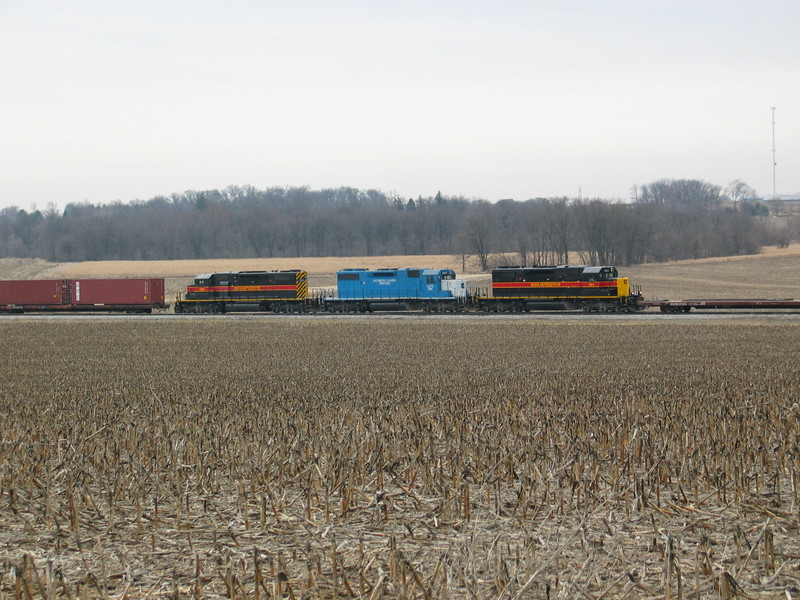 RI turn (with the Wilton Local crew) picks up loaded HSs from the west end of West Lib. siding.  March 23, 2006.