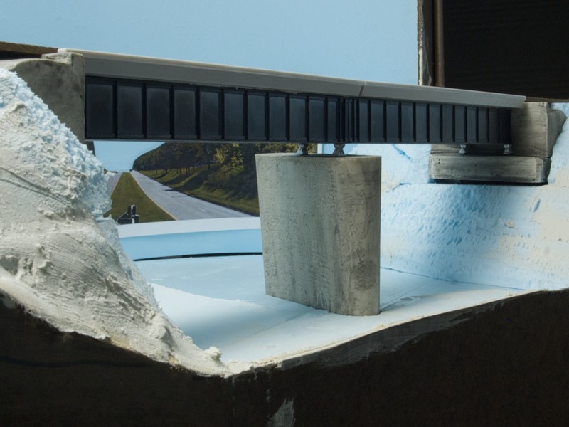 The pier and abutments were stained using a wash made from inexpensive acrylic paints.  More weathering will complete them.  The bridge is scheduled to receive additional details, including safety rails and support brackets, before painting and weathering.