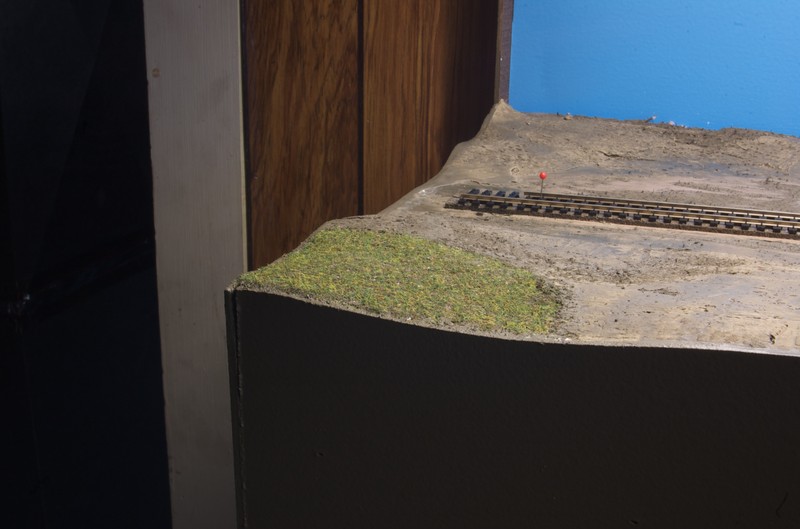 A test section of finished scenery using Scenic Express Farm Pasture.  More variety and depth of grass will be used on the finished product.